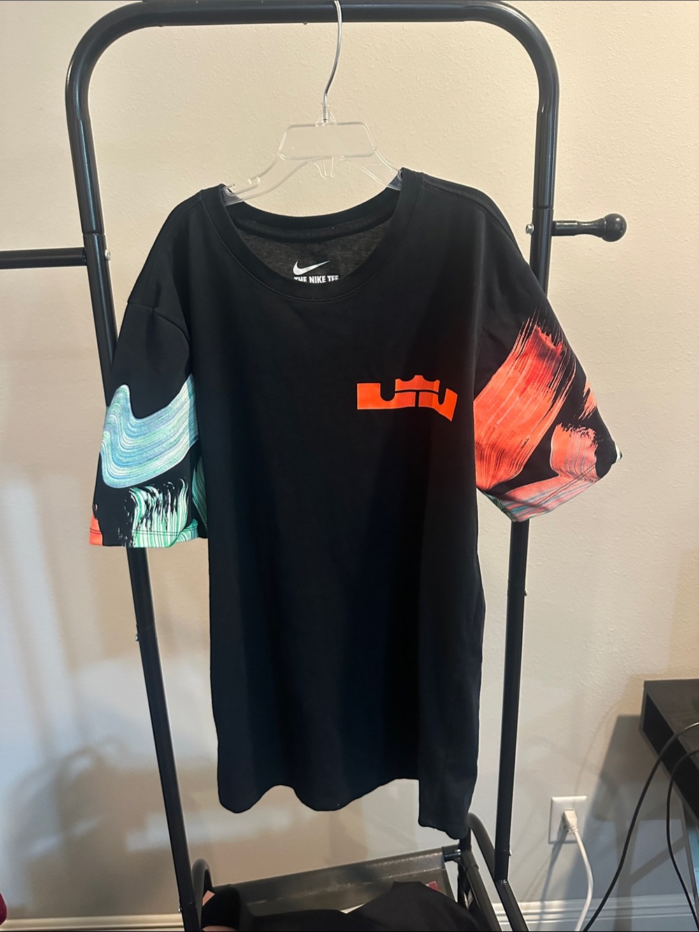 Nike Black Short-Sleeve Tee with Orange Chest Logo and Multicolor Sleeve Art